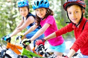 Boys and girls ready to start biking